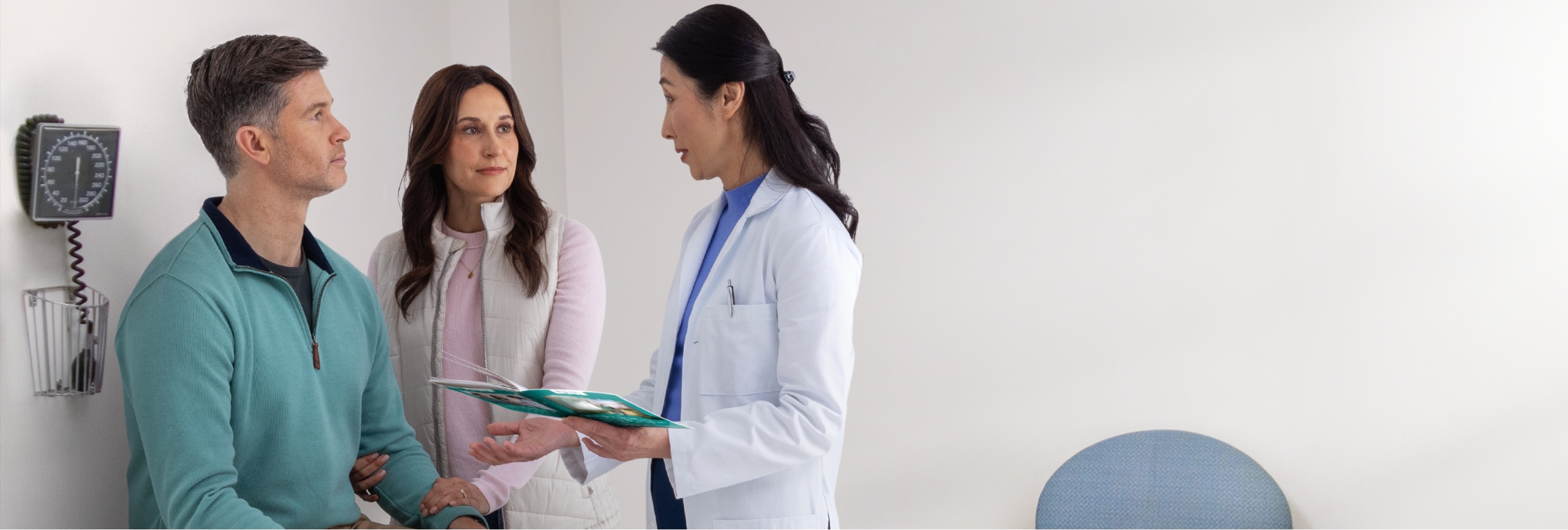 Actor portrayal of an HD patient and their caregiver having a productive conversation with a doctor